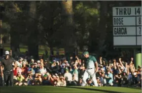  ?? MATT SLOCUM — THE ASSOCIATED PRESS FILE ?? In this April 9 photo, Sergio Garcia, of Spain, right, reacts after putting in for an eagle on the 15th hole during the final round of the Masters golf tournament, in Augusta, Ga. Garcia considers it the most memorable shot of his Masters victory.