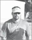  ?? Photos by Fred Conley ?? Former Forrest City football coach Chris Kennon, now at McCrory, watches his team work through warmups for Tuesday's 7-on-7 event held at Palestine-Wheatley. Kennon has been the McCrory head football coach for 10 seasons.