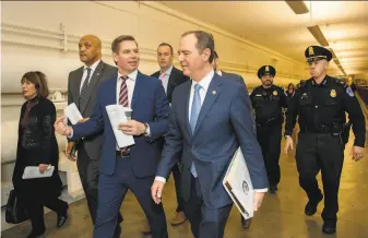  ?? Amanda Andrade- Rhoades / Special to The Chronicle 2019 ?? Rep. Eric Swalwell of Dublin ( third from left) walks with Rep. Adam Schiff of Burbank at the Capitol. They are possible picks to replace California Attorney General Xavier Becerra.