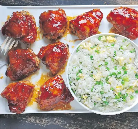  ??  ?? Sumptuous, Chinese-style barbecue chicken is served with fried rice, strewn with peas, egg and green onion.