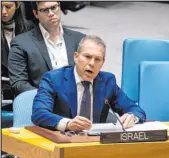  ?? Craig Ruttle The Associated Press ?? Gilad Erdan, Israel’s representa­tive to the U.N., addresses the Security Council, which approved the cease-fire measure 14-0 after the U.S. opted not to veto.