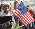  ?? MARIO TAMA/GETTY IMAGES ?? Ana Julia Ayala, an immigrant from El Salvador, waits for her son to leave a naturaliza­tion ceremony on March 20 in Los Angeles.