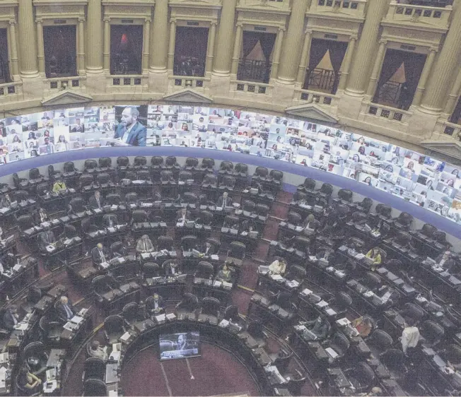  ??  ?? Argentina National Congress in Buenos Aires used screens to show the faces of deputies who participat­ed remotely