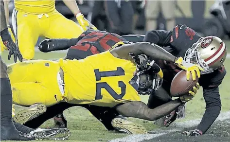  ?? BEN MARGOT/THE ASSOCIATED PRESS ?? Los Angeles Rams wide receiver Sammy Watkins (12) scores a touchdown against the San Francisco 49ers during the second half of Thursday’s game in San Francisco. The Rams won the thriller 41-39.