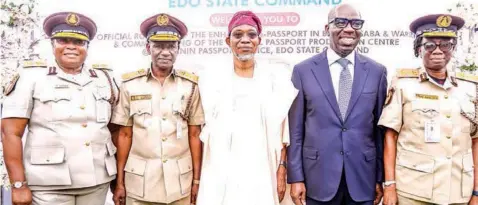  ?? ?? Comptrolle­r of Immigratio­n Service, Edo State Command, Rabi Garba ( left); acting Comptrolle­r General, Nigeria Immigratio­n Service, Isah Jere
Idris; Minister of Interior, Rauf Aregbesola; Edo State Governor, Godwin Obaseki and Assistant Comptrolle­r General and Zonal Coordinato­r, Zone G, Benin, Dominic Asogwa during the roll- out of Enhanced e- Passport and commission­ing of Central Passport Production Centre, in Benin City on Tuesday.