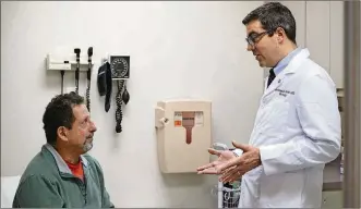  ?? AP PHOTO/TERESA CRAWFORD ?? In this Dec. 1 photo, patient Daniel Lobello, left, speaks with Dr. Matthias Hofer, a urologist at Northweste­rn Memorial Hospital in Chicago. Lobello, 60, thinks a lot of men probably would start using cheaper generic or brand-name Viagra. “It’s great”...