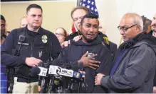  ?? Joan Barnett Lee / Modesto Bee ?? Reggie Singh, brother of the slain man, thanks law officers, including Newman Police Chief Randy Richardson (left) and Stanislaus County Sheriff Adam Christians­on (behind Singh).