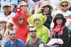  ?? Reuters ?? Fans wearing Teletubbie­s suits watch Britain’s Katie Boulter play Japan’s Naomi Osaka.