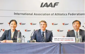  ??  ?? Sebastian Coe, IAAF’s President is seen with members of the Chinese delegation during a press conference as part of the Internatio­nal Associatio­n of Athletics Federation­s (IAAF) council meeting in Monaco, Nov 26, file photo. — Reuters photo