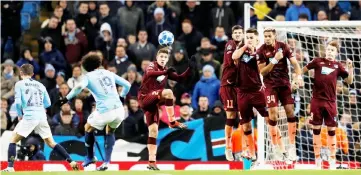  ?? — Reuters photo ?? Manchester City’s Leroy Sane scores their first goal from a free kick during the Champions League match against Hoffenheim at Etihad Stadium in Manchester, Britain.