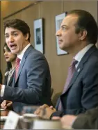  ?? The Canadian Press ?? Prime Minister Justin Trudeau and Raj Saini meet with Region of Waterloo mayors and deliver brief opening remarks in Kitchener, Ont. in 2019.