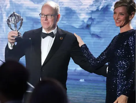  ?? ?? Above: HSH Albert II of Monaco receiving the Lifetime Achievemen­t Award from actress Uma Thurman, during the Hollywood for the Global Ocean Gala in Los Angeles in 2020. Opposite: The Global Fund for Coral Reefs initiative has been set up to safeguard coral reef ecosystems and preserve the economic and social developmen­t of the communitie­s that depend on them
