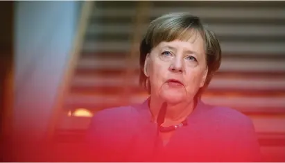  ??  ?? German Chancellor Angela Merkel of the Christian Democratic Union speaks before the coalition talks at the Social Democratic Party headquarte­rs in Berlin on Sunday.