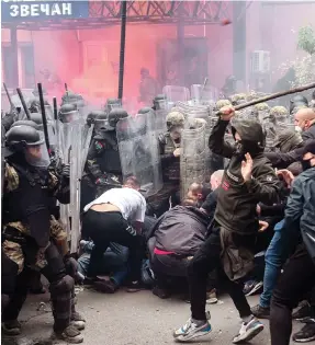  ?? Photo: EPA ?? KFOR forces clash with ethnic Serbs attempting to enter a municipal building in Zvecan, Kosovo.