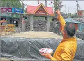  ?? HT PHOTO ?? A man makes an offering at the entrance to the Kheer Bhawani temple at Tulmulla in Ganderbal on Saturday.