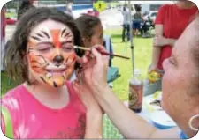  ?? Photo by Petra Chesner Schlatter ?? Helena Hoffman, 13, said it was awesome to get her face painted like a tiger.