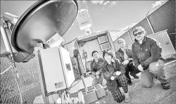  ??  ?? Professor Pavlos Kollias, (centre/ back), and colleagues at Stony Brook’s Radar Observator­y. — Photo courtesy of Stony Brook University