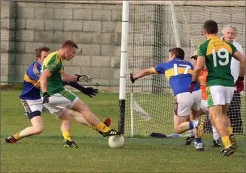  ??  ?? Keith O’Hara scoring a goal for HWH-Bunclody in Bellefield on Saturday.