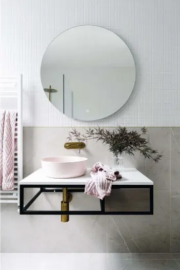  ??  ?? BATHROOM
A mix of soft grey and pale pink hues adds a sophistica­ted elegance.
Cobalt Quartz vanity unit, from AU$1,500, ADP. Sierra matt pink sink, from AU$500, Castano. Mizu Drift shower and tapware, from AU$1,500, Reece