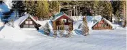  ?? Josh Edelson/For The Washington Post ?? Snow covers homes in Soda Springs, Calif., on Thursday. California has seen a large amount of snow, but it’s not clear whether it will be enough to ease the state’s drought.