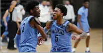  ?? MATT SLOCUM - THE ASSOCIATED PRESS ?? Villanova’s Brandon Slater, left, and Justin Moore react after a basket during a game against St. John’s last month. Collin Gillespie’s absence on the floor will put more responsibi­lity on both players going forward.