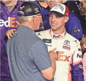  ?? GETTY IMAGES ?? Denny Hamlin celebrates with team owner Joe Gibbs after the race.