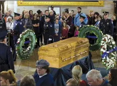  ?? AP/JOSE LUIS MAGANA ?? Visitors pay their respects Wednesday as the casket of the late Rev. Billy Graham lies in honor at the Capitol rotunda in Washington. Graham, 99, died Feb. 21 at his North Carolina home.