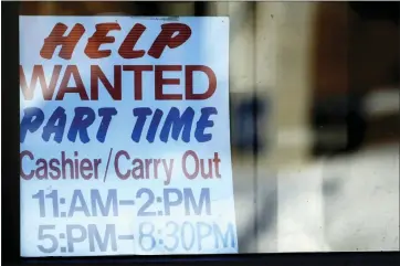  ?? NAM Y. HUH — THE ASSOCIATED PRESS FILE ?? A help wanted sign is at a restaurant in Arlington Heights, Ill. Applicatio­ns for jobless aid in the U.S. for the week ending Feb. 4rose by 13,000last week to 196,000, from 183,000the previous week, the Labor Department reported Thursday. It’s the fourth straight week claims were under 200,000.