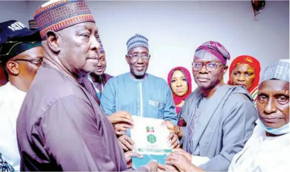  ?? ?? Former Secretary to the Government of the Federation, Babachir David Lawal ( left); and Lagos State Governor Babajide Sanwo- Olu ( second right) lead other APC chieftains to submit the Expression of Interest and Presidenti­al Nomination Form of the party’s National Leader, Asiwaju Bola Tinubu, at the Internatio­nal Conference Centre in Abuja… yesterday.