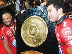  ??  ?? Silverware: Maxime Mermoz, right, and Mathieu Bastareaud display the French Top 14 trophy won by Toulon in 2014