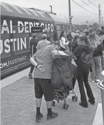  ?? AUSTIN AMERICAN-STATESMAN ?? Austin FC Fans take the CapMetro train to the new McKalla Station.