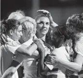  ?? Cooper Neill / Getty Images ?? Alex Morgan, center, celebrates with her U.S. teammates aafter scoring one of her two goals in a 6-0 victory over Jamaica on Sunday night.