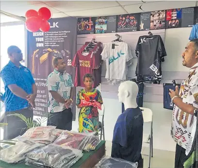  ?? Picture: SUPPLIED ?? BLK Sales manager Donasiano Kalou (far right) explains about their products during the re-opening of the outlet in Lautoka on Saturday.