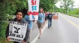  ?? — AP ?? MONTPELIER: Scores of dairy farm workers and activists march.