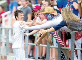  ?? Jason Ivester/NWA Democrat-Gazette ?? Siloam Springs sophomore Eli Jackson celebrates with fans after scoring his third goal Friday against Mountain Home at Razorback Field in Fayettevil­le in the 6A state championsh­ip game.