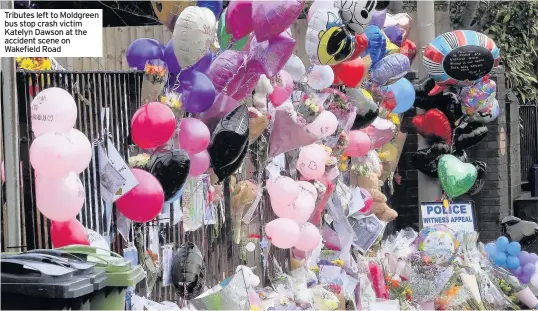  ??  ?? Tributes left to Moldgreen bus stop crash victim Katelyn Dawson at the accident scene on Wakefield Road