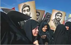  ?? AP ?? Iranians attend the state funeral of Mohsen Hojaji, a young Revolution­ary Guard soldier beheaded by Daesh in Syria.