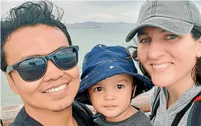  ??  ?? Zulfirman Syah, left, with his 2-year-old son, Averroes, and his wife, Alta Sacra. Syah shielded his son from the bullets in the Linwood mosque attack on Friday. He is in hospital with serious injuries.