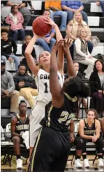  ?? Jeremy Stewart / RN-T ?? Coosa’s Taylor Roberts (left) takes a shot over Rockmart’s Anbria Daniels.