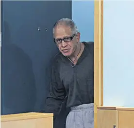  ?? Photo / Michael Craig ?? Malcolm Rewa in the dock at the Auckland High Court where he is facing a retrial for the rape and murder of Susan Burdett in 1992.