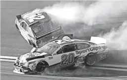  ??  ?? Erik Jones (20) and Kyle Larson (42) wreck going through Turn 4 during the Busch Clash exhibition race Sunday at Daytona Internatio­nal Speedway in Daytona Beach, Fla. DARRYL GRAHAM/AP