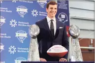  ?? Elsa / Getty Images ?? Eli Manning of the New York Giants poses with the Vince Lombardi Trophies after a press conference to announce his retirement on Jan. 24, 2020 at Quest Diagnostic Training Center in East Rutherford, N.J.