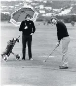  ??  ?? Or golf? Gordon Brown and Bill Beaumont battle the conditions