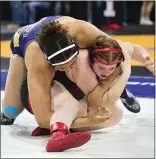  ?? Bakersfiel­d.com. ELIZA GREEN / THE CALIFORNIA­N See more photos at ?? ABOVE: Naomi Roby, a senior at Golden Valley, gets the upper hand against opponent Emma Ford from Fair Oaks-Bella Vista during a matchup Friday at the CIF State Wrestling Championsh­ip Tournament.
RIGHT: Bakersfiel­d High senior Tye Monteiro is declared the winner of a match against Valencia’s Alex Munoz.