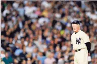  ?? Rob Tringali / Getty Images ?? Hall of Fame pitcher Whitey Ford stands on the field during ceremonies before the last game played at Yankee Stadium on Sept. 21, 2008. Ford, a Cy Young winner and World Series MVP, died on Friday at 91.