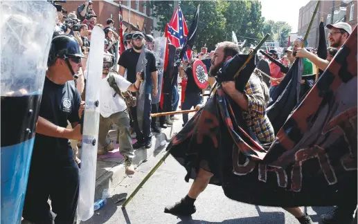  ?? (Reuters/Joshua Roberts) ?? WHITE SUPREMACIS­TS clash with counter protesters at a rally in Charlottes­ville, Virginia, in August 2017.