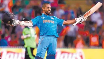  ?? Picture: AFP ?? DOMINANT. India’s Shikhar Dhawan celebrates his century in their World Cup Pool B match against Ireland in Hamilton yesterday.