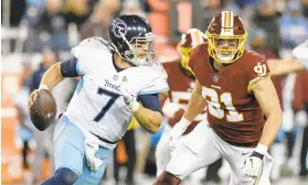  ?? MARK ZALESKI/AP ?? Tennessee Titans quarterbac­k Blaine Gabbert is pressured by Washington Redskins outside linebacker Ryan Kerrigan in the second half of Saturday’s game in Nashville. The Titans won the game 25-16.