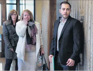  ?? CP PHOTO ?? Christophe­r Calvin Garnier, right, charged with second-degree murder in the death of Truro police officer Const. Catherine Campbell, arrives at Nova Supreme Court with family members in Halifax on Tuesday.