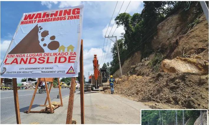  ?? SETH DELOS REYES ?? THE DANGER IS REAL. Workers clear the road of fallen debris and stones that were brought by the landslide last Saturday morning. A large chunk of earth on the slopes along a portion of the Diversion Road in Ma-a has been observed to have cracks,...